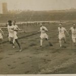 photo of competitors crossing the finish line of a running race